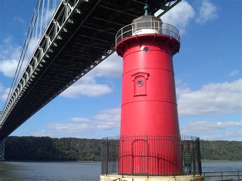 red house lighthouse with metal bridge roadway|little red lighthouse new york.